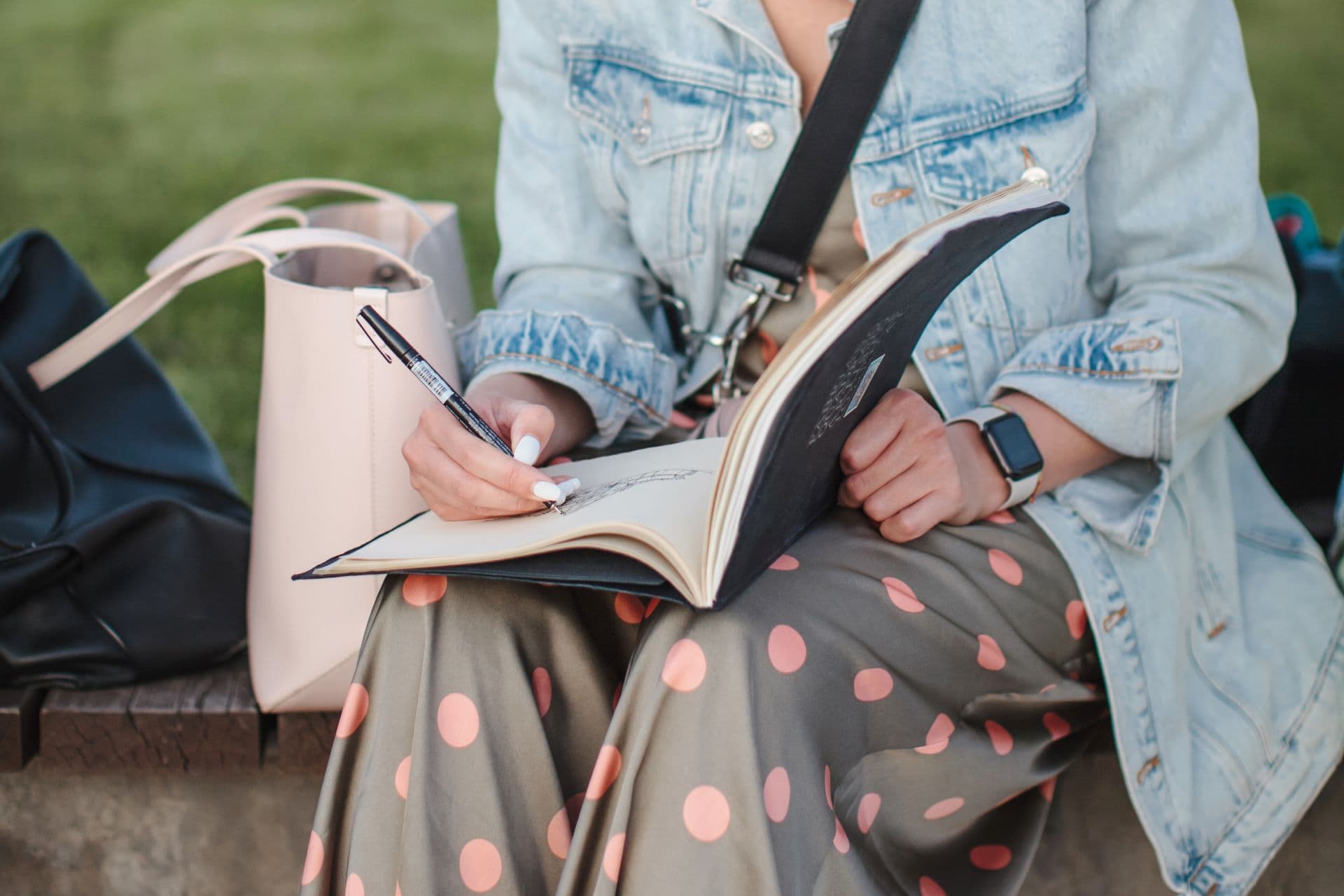 Woman writing in a notebook during a travel break